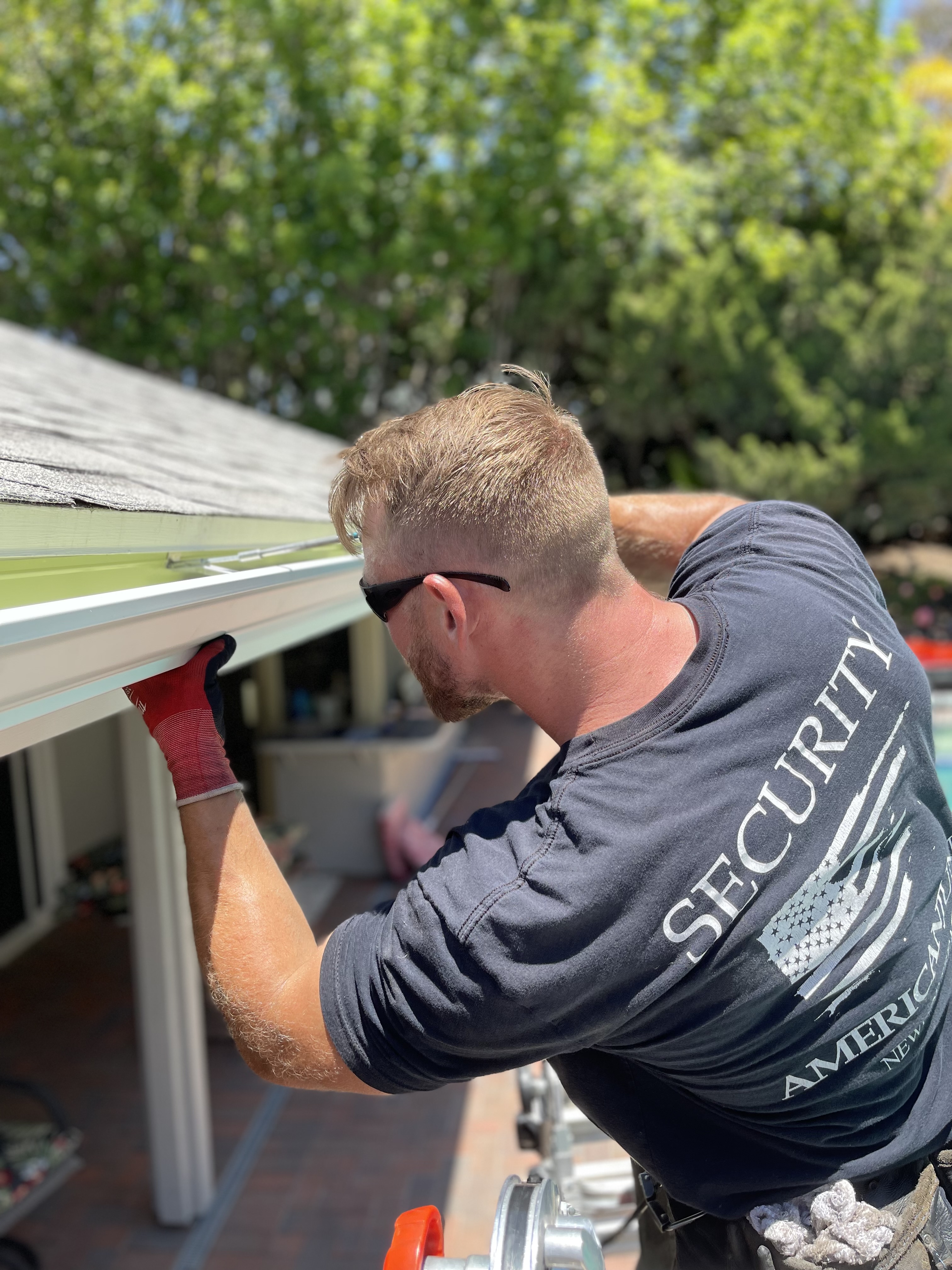 Owner installing gutters