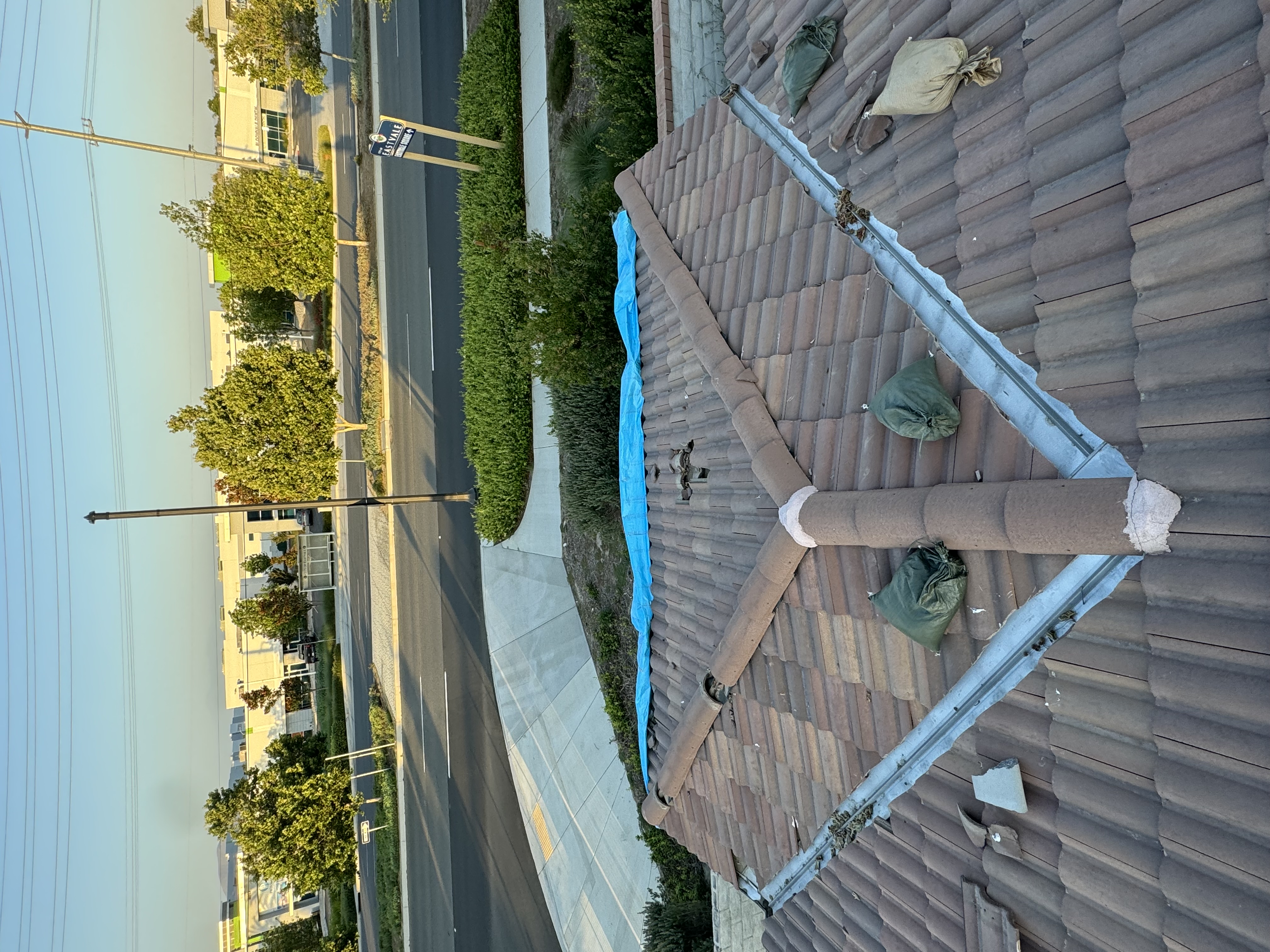 Emergency tarp protection over damaged roof section