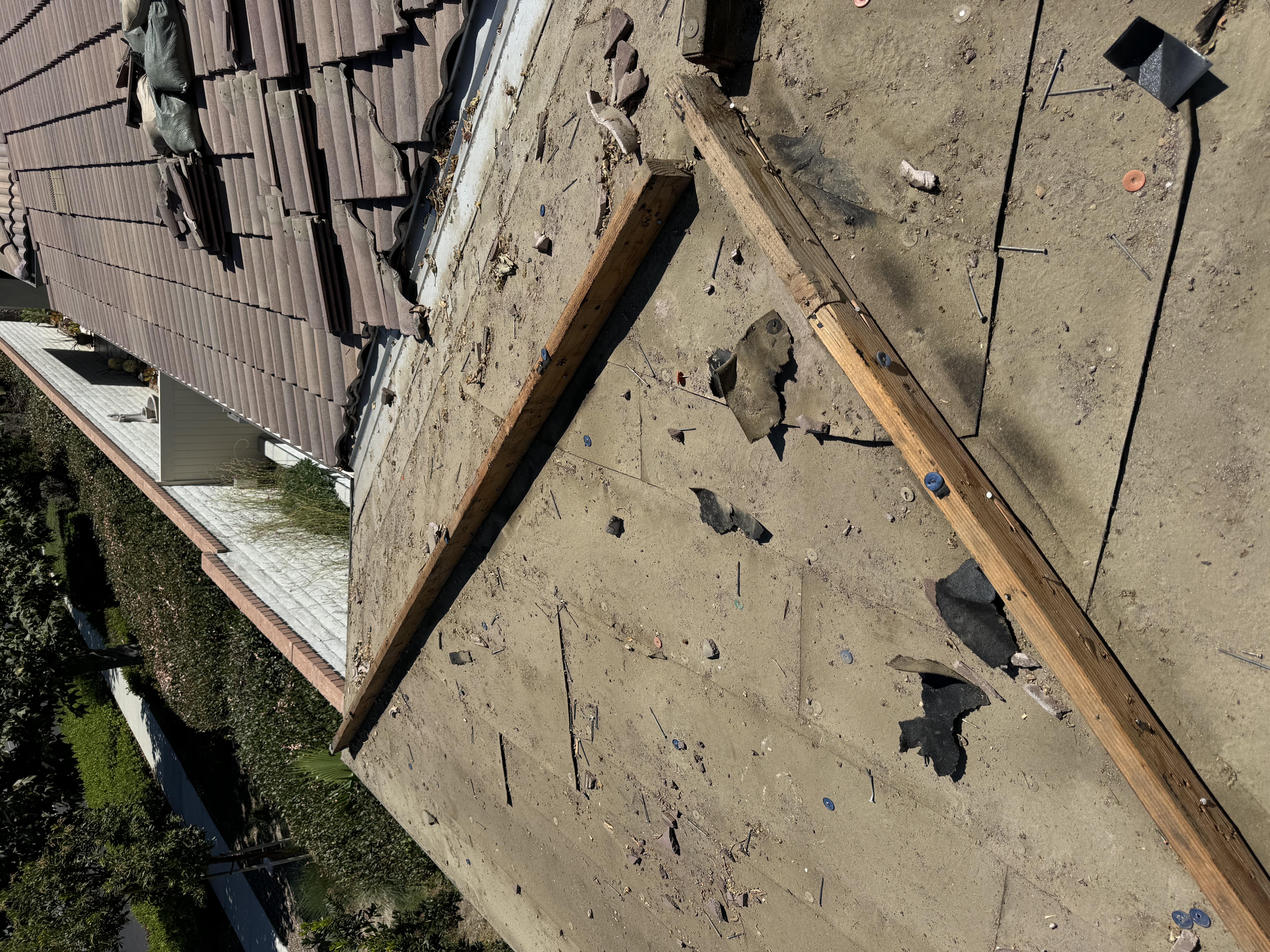 Roof tile tear-off in progress