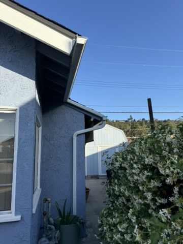 White gutter on stucco home