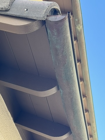 Worn half-round gutter